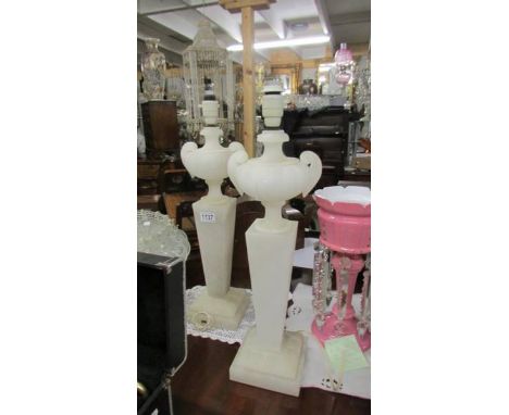 A pair of tall alabaster table lamp bases. Height 50cm not including bulb holder