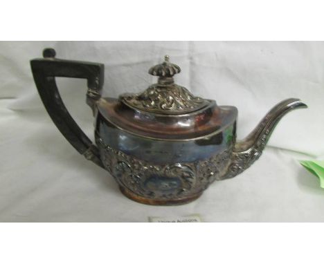 A decorative silver teapot. Approximately 330 grams.  