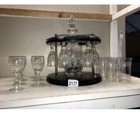 A decanter &amp; glasses on wooden stand &amp; 2 sets of 6 glasses. Collect only.  