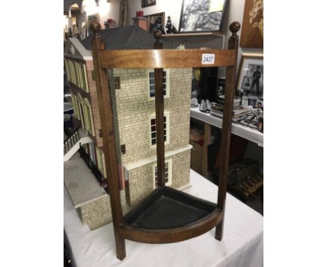 An Edwardian oak corner stick/umbrella stand  