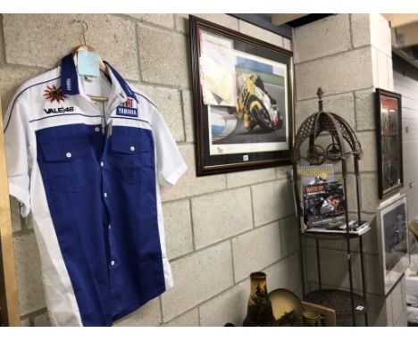 A Valentino Rossi limited edition print signed by Rossi and artist Vs Bacci and Melbourne loop British GP 2002. Yamaha team s
