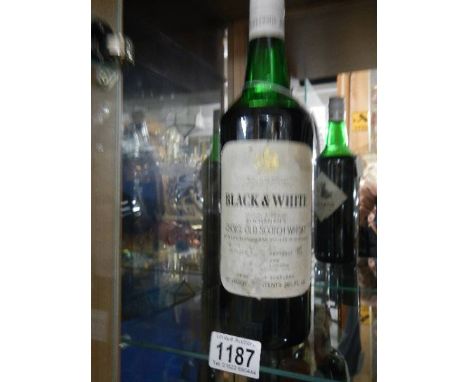 A bottle of Black &amp; White Buchanan's Scotch whisky.