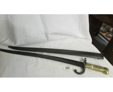 An old bayonet in sheath.*CONDITION REPORT* Scabbard has lots of pitting but no visible dents.Photo's of numbers are illegibl