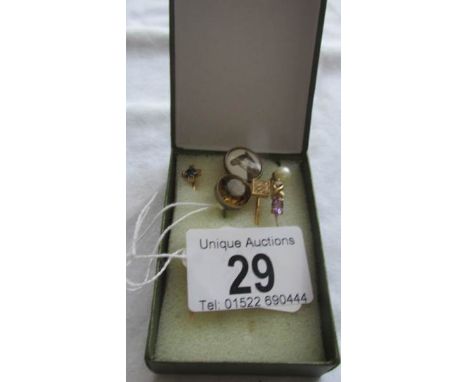 Six assorted stick pins including gold examples.  