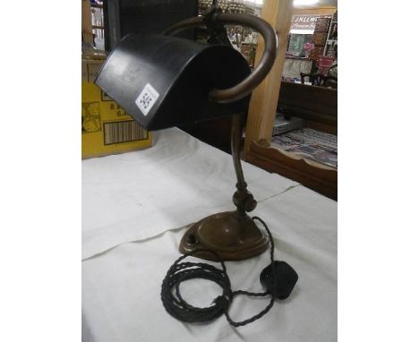 An art nouveau bankers lamp.*CONDITION REPORT*Lovely patina to brass.Metal shade in good condition & may have been repainted 