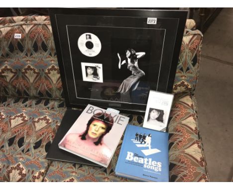 A limited edition print/signed CD of Kate Bush with unique Black and white photo by J.Bangay in glazed picture frame, 60cm x 