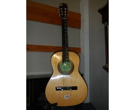 An acoustic guitar. Collect only  Skylark brand MG - 104, some marks/scratches to side of main body, otherwise in good condit