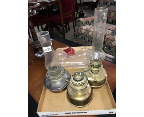 A collection of oil lamp parts including Chimney fonts etc.  