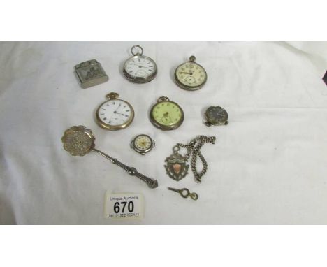 A mixed lot of pocket watches, lighter, watch fob etc.,