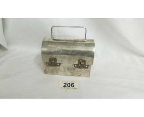 A Cartier sterling silver handbag in the form of a trunk, mid century, with Vanessa monogram, signed to base.  The size is He