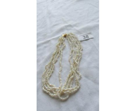 A five strand natural pearl necklace.  