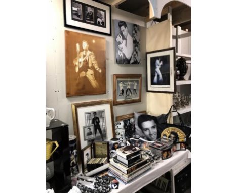 A large collection of Elvis memorabilia including Clock, lamp, pictures, mugs, shower curtain, cd's, tape cassettes, handbag,