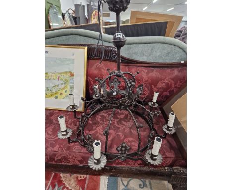 A WROUGHT IRON EIGHT LIGHT CHANDELIER