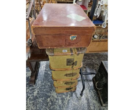 A LEATHER SUITCASE TOGETHER WITH A CANVAS COVERED TRUNK