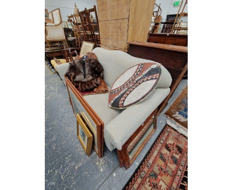 A WESLEY BARRELL THREE SEAT SETTEE UPHOLSTERED IN PALE BLUE, THE BUN LEGS ON BRASS CASTER FEET.