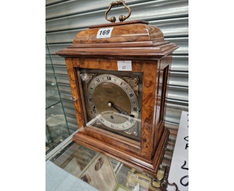 A WALNUT CASED ELLIOTT MANTEL CLOCK CHIMING ON EIGHT RODS AND RETAILED BY BROWN OF SHEFFIELD