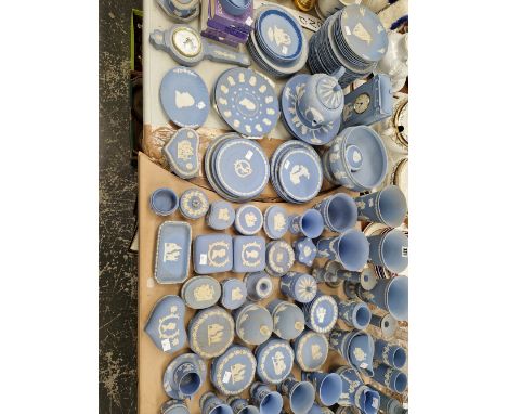 A LARGE COLLECTION OF WEDGWOOD BLUE JASPER WARES, TO INCLUDE: A CLOCK, A BAROMETER AND COMMEMORATIVES