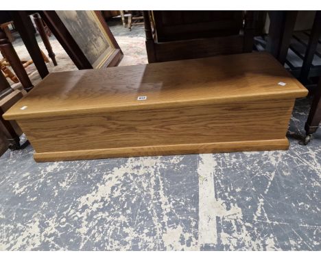 A MODERN OAK COFFER OR TRUNK