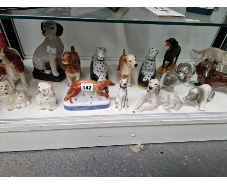 A COLLECTION OF CERAMIC DOGS