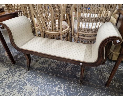 A 19th C. MAHOGANY WINDOW SEAT WITH FLUTED LEGS SPLAYING TO BRASS CASTER FEET.