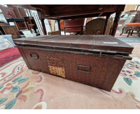 A METAL TRUNK WITH SOME DEGRADED LABELLING