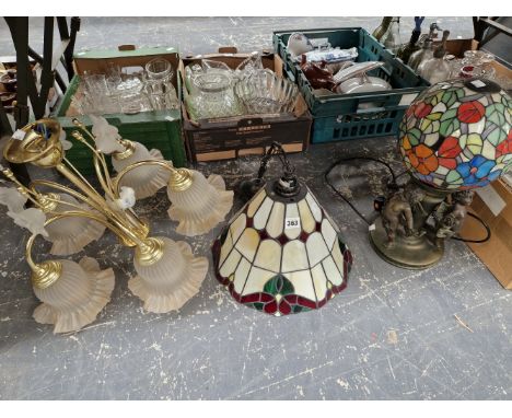 A TIFFANY STYLE LEADED GLASS GLOBE TABLE LAMP, A LEADED GLASS CEILING SHADE AND A BRASS CHANDELIER WITH FIVE GLASS SHADES