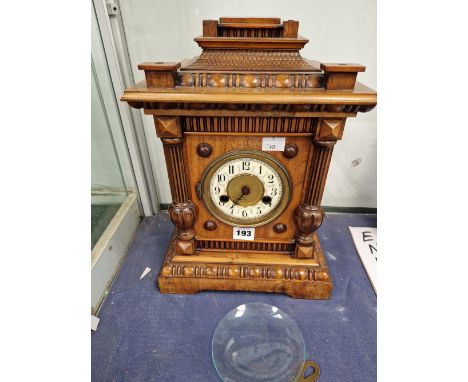A WALNUT CASED WURTEMBERG MANTEL CLOCK STRIKING ON A COILED ROD
