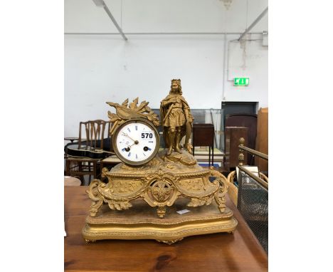 A LATE 19th C. FRENCH GILT SPELTER MANTEL CLOCK STRIKING ON A BELL AND SURMOUNTED BY A ROYAL KNIGHT