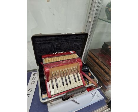 A HOHNER ACCORDION TOGETHER WITH A CASED CLARINET