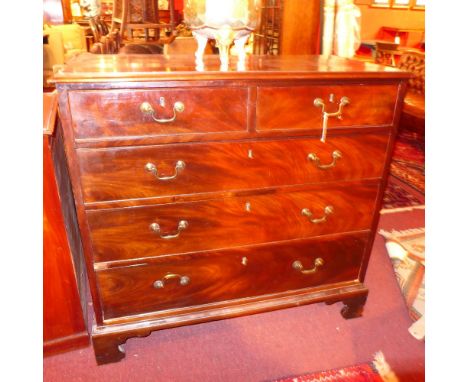 A George III mahogany chest of two short above three long drawers on bracket feet