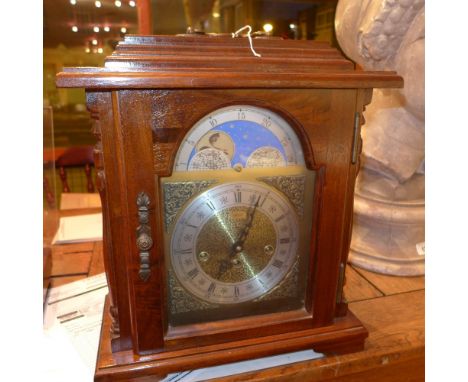 A walnut cased 'Emperor' mantle clock with moon detail 