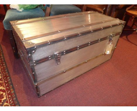 An aluminium clad and leather bound storage trunk