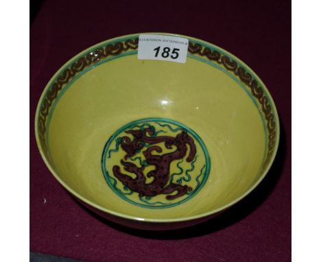 A Chinese porcelain bowl having a yellow ground