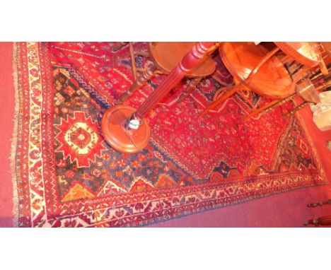 A fine south west Persian Afshar carpet 325cm x 225cm bearing a linked chain of pole medallion with repeating petal and anima