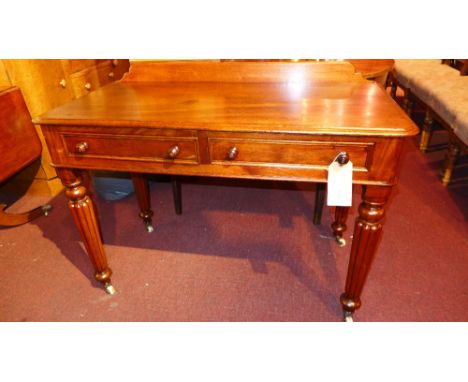 A Victorian mahogany side table fitted two drawers on bracket feet