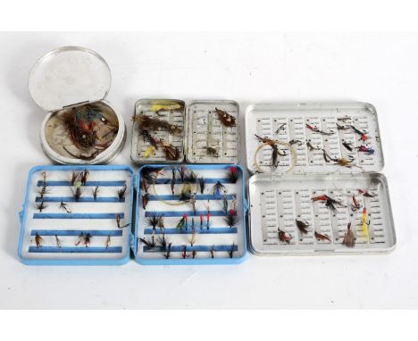 Four assorted fly boxes and flies, including: a vintage Perrine metal fly box, a small metal box by Wheatley, a circular meta