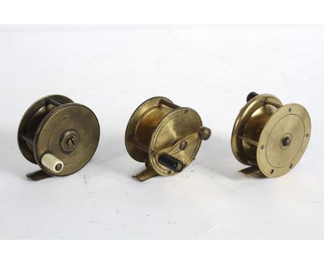 A group of three vintage brass fishing reels, one stamped DAM/Effzett 495, each approximately 6. 2 cm diameter (3)