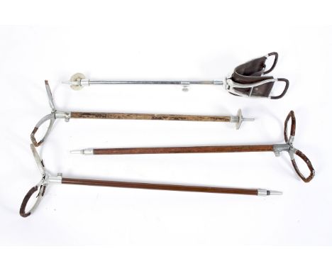 Four vintage shooting sticks, each folding leather mounted example on wood or metal stem, 86 cm long maximum