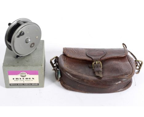 A Freedix fishing reel (Salmon and General Spinning Reel, size 4 inches), boxed, together with a vintage leather bag branded 