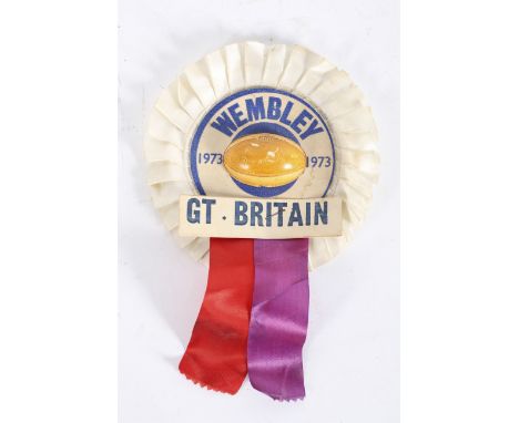 A 1973 Wembley GB rugby rosette and a vintage wooden clacker, the clacker, 27 cm long 