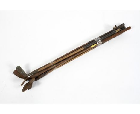 Seven vintage hickory handled golf clubs, including W. Parker and others, approximately 90 cm long 