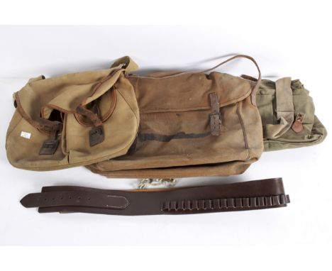 Three vintage canvas fishing bags and a brown leather ammunition gun belt
