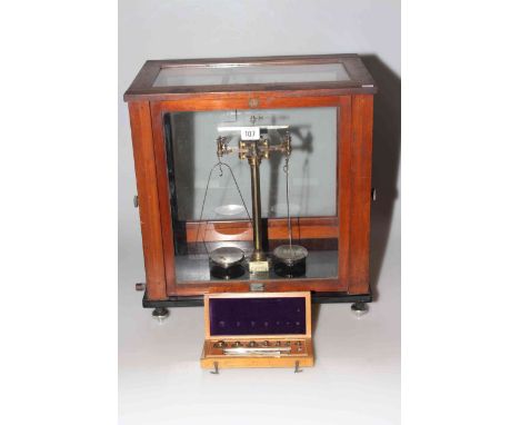 Old fashioned pharmaceutical scales and weights by Baird and Tatlock