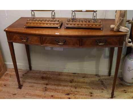 Mahogany bow front console table with frieze drawers