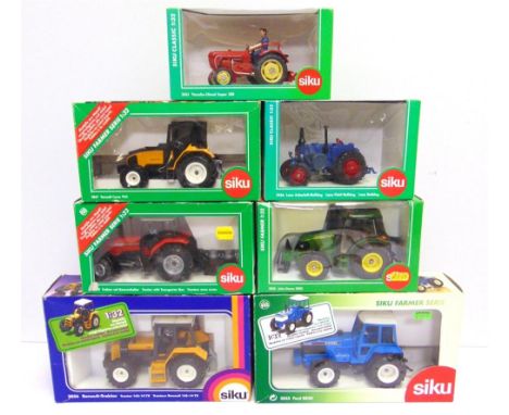 SEVEN 1/32 SCALE SIKU MODEL TRACTORS  comprising a No.2855, Ford 8830; No.2853, Massey Ferguson 4270 with Transporter Box; No