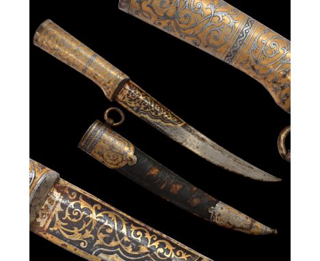 RARE HUNTING KNIFE, DECORATED WITH GOLD AND BLUE, RUSSIAN EMPIRE, ZLATOUST, 1889. The blade is steel, curved, with one fuller