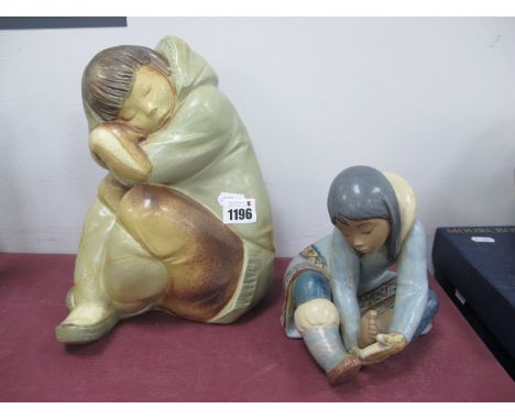 A Lladro Matte Porcelain Figure of a Sleeping Eskimo, printed and impressed marks, 25cm high; Another, of a girl looking at h