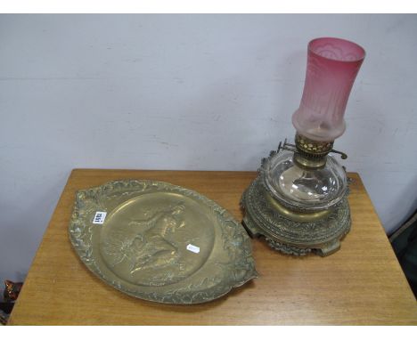 A XIX Century brass Oil Lamp, with a glass shade, glass well, brass base with acanthus and bead work decoration; together wit