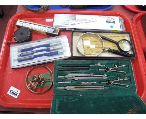 Ecobra Geometry Set, magnifiers, Bakelite tape measure, Parker Slimfold pen having 14k nib, rolled gold bangle, etc::- One Tr
