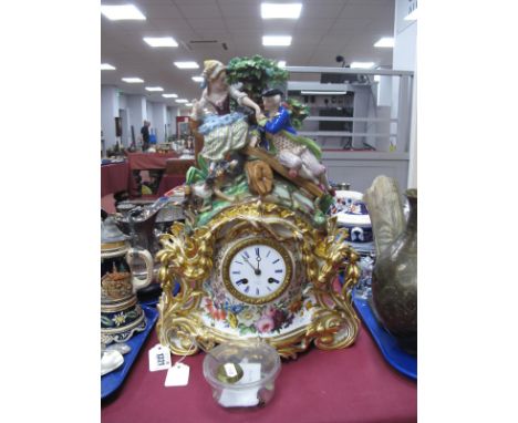 A Late XIX/Early XX Century Porcelain Mantle Clock, the two section case in the form of an XVIII Century couple and a dog sea